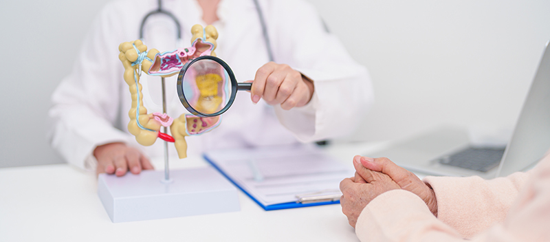 A patient receiving a consultation at a colorectal clinic